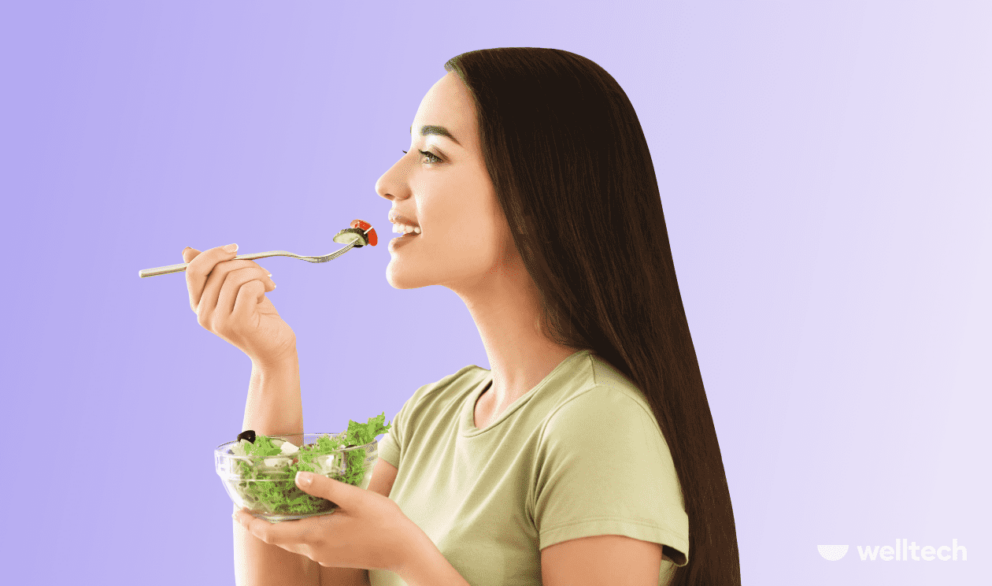 a woman is eating salad, smiling, How to Change Your Eating Habits