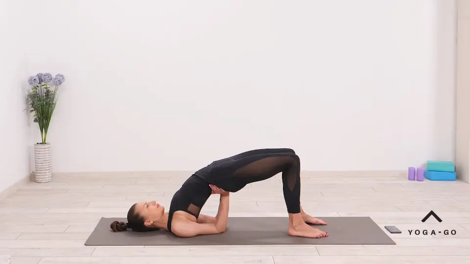 a woman is practicing Bridge Pose With One Leg Raised_Eka Pada Setu Bandha Sarvangasana_cool down yoga