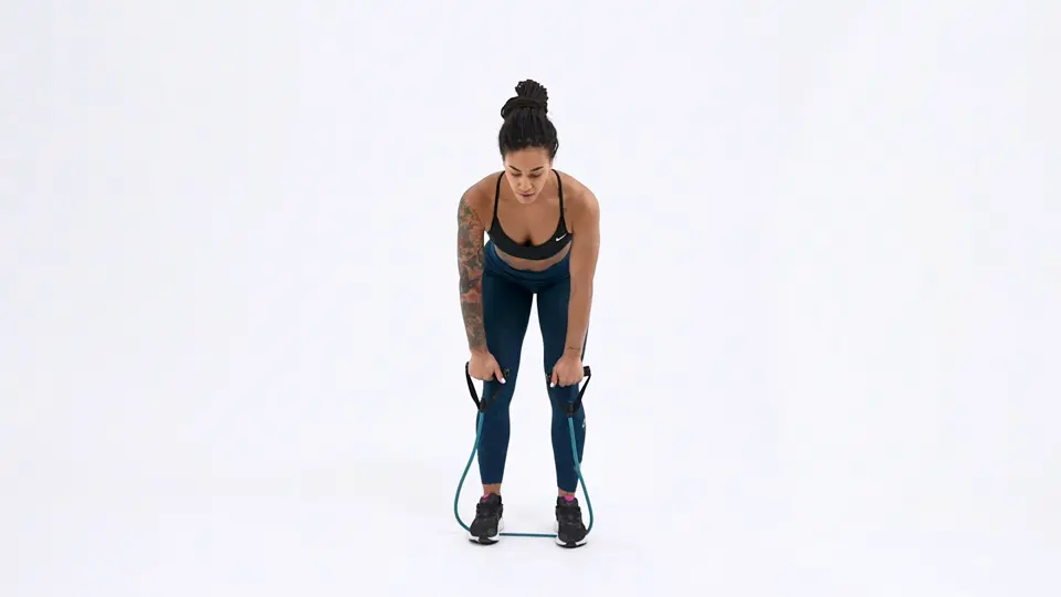 a woman is performing bent-over rows with a resistance band_bra back fat