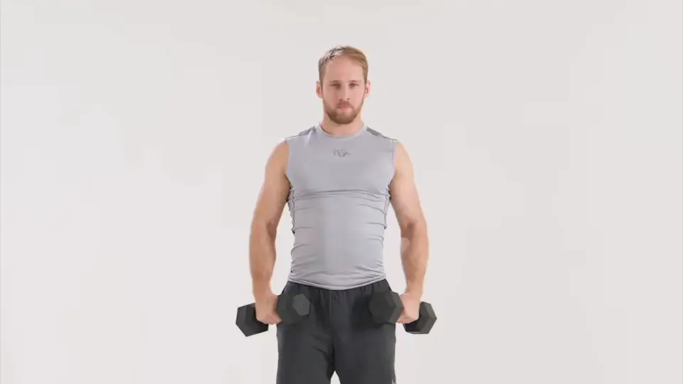 a man is performing Dumbbell Lateral Raises_dumbbell push workouts