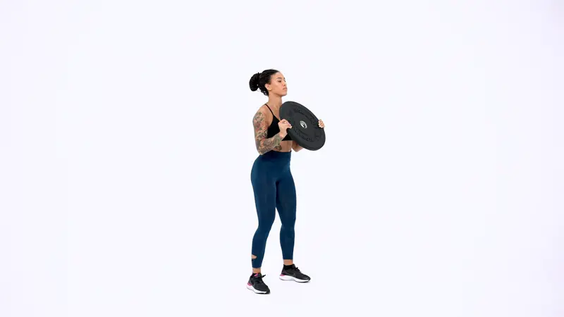 a woman is performing Goblet Squat with Plate Press_box jump alternative
