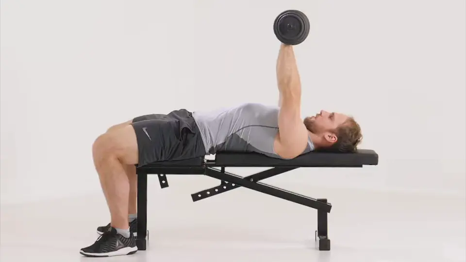 a man is performing chest press with dumbbells_dumbbell push workouts