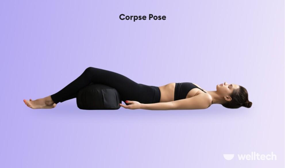 a woman is practicing restorative yoga_Corpse pose__yoga poses with a bolster