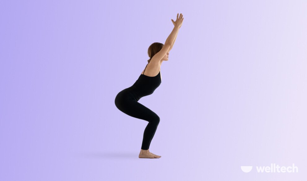 a woman is performing Chair Pose_Utkatasana_Yoga for Glutes