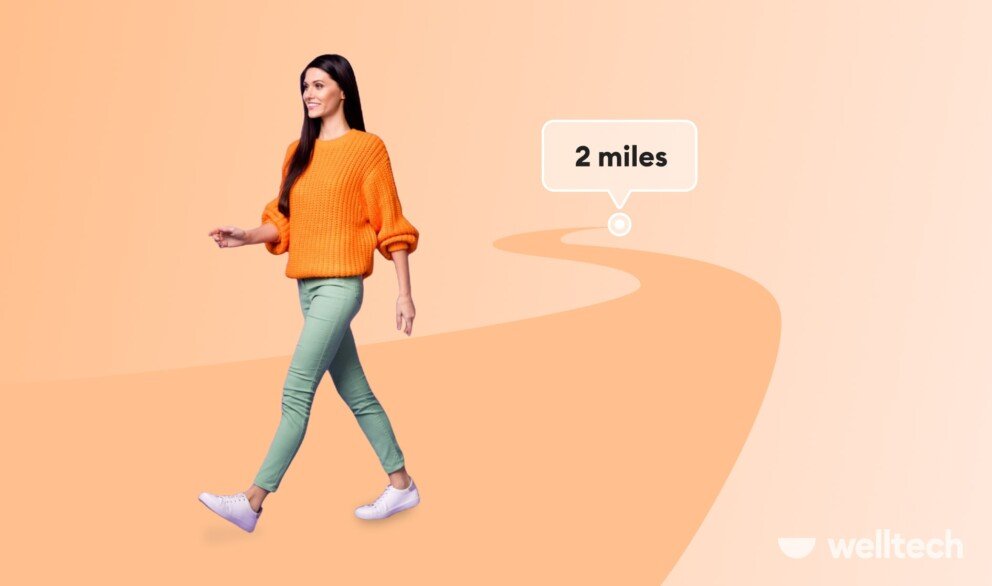 a young woman in orange sweater is casually walking, smiling, walking 2 miles a day