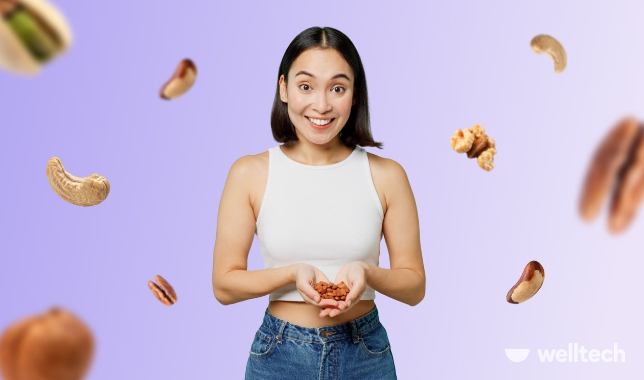 a young woman is holding almonds in her hands, smiling, keto nuts