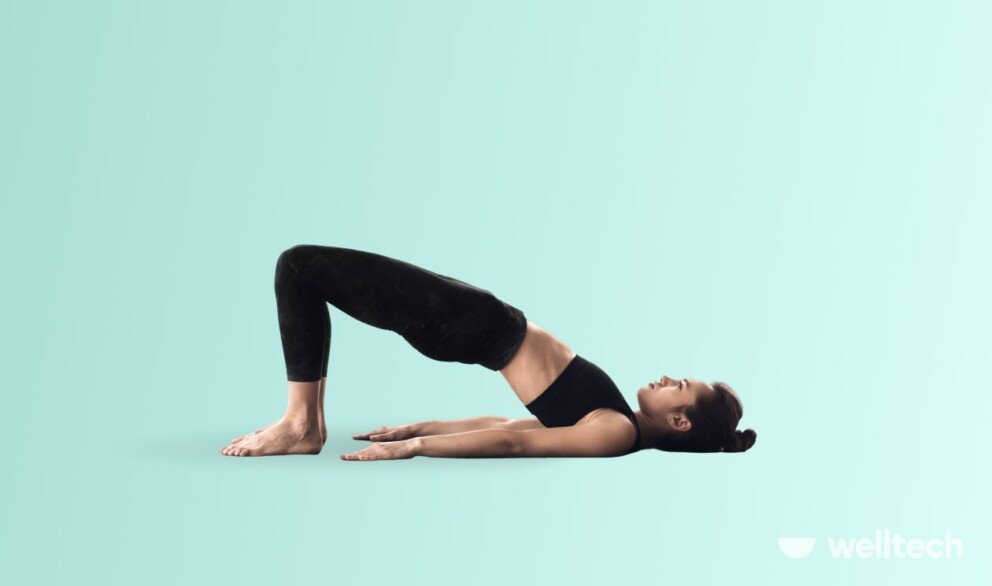 a woman is practicing yoga, doing Bridge Pose (Setu Bandha Sarvangasana)_yoga for belly fat