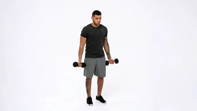 a man is performing Drag Dumbbell Curl_long head bicep exercises