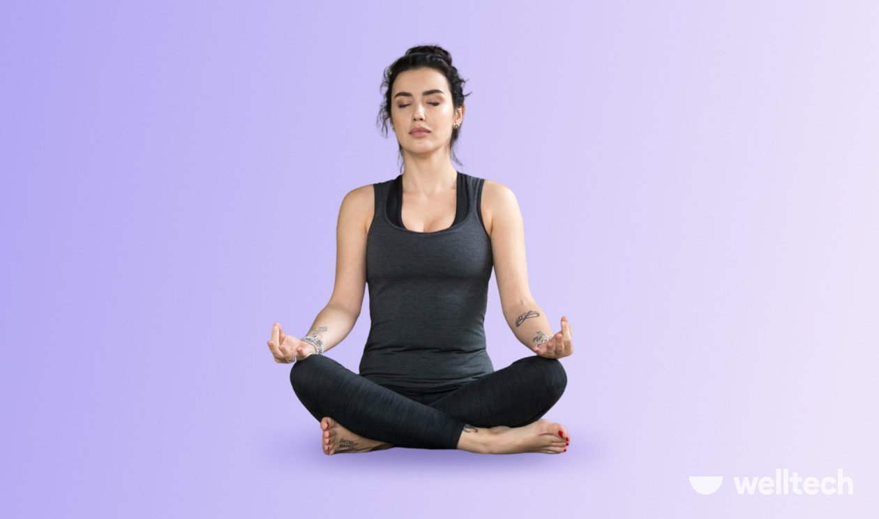 a woman is practicing yoga, doing Easy Pose_seated yoga poses