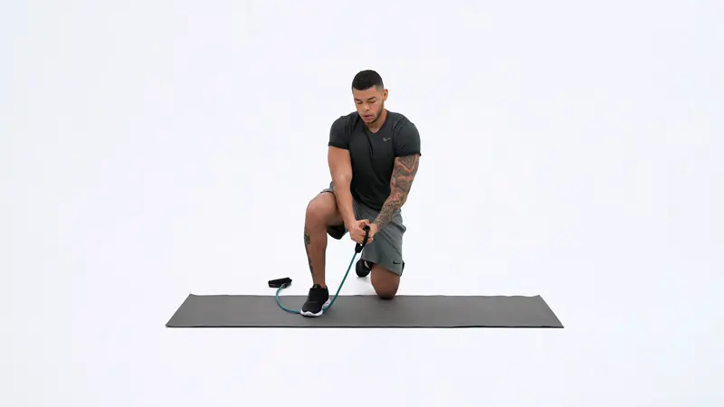a man is performing Handle_Band_Half_Kneel_Wood_Chop_ab exercises that don’t hurt lower back