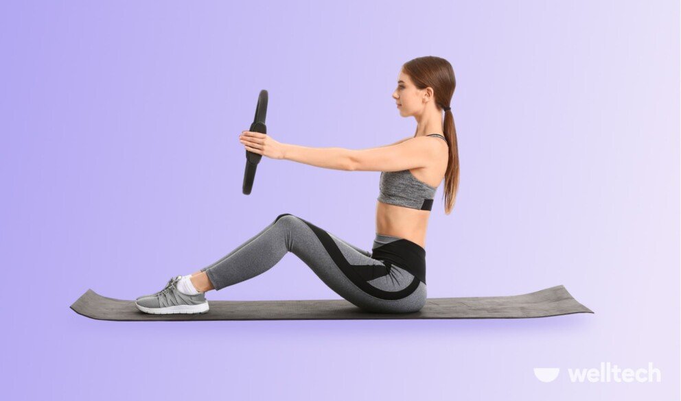 a woman is doing sit ups with pilates ring_how to use pilates ring