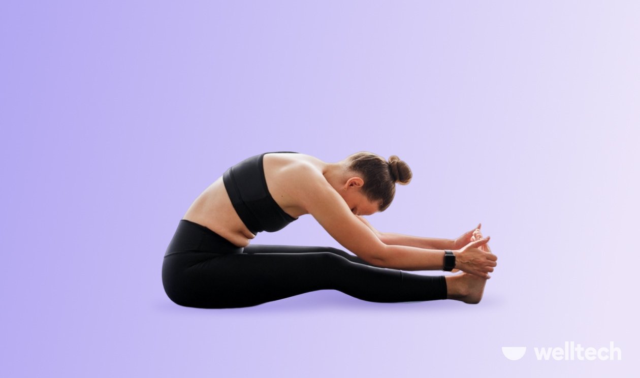 a woman is practicing yoga, doing Seated Forward Fold_seated yoga poses