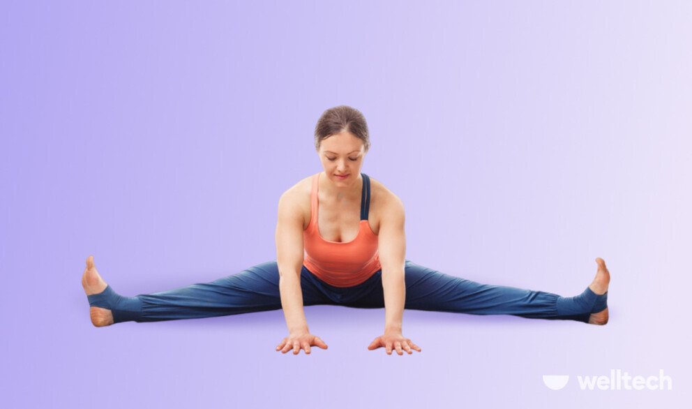 a woman is practicing yoga, doing Wide Angle Seated Forward Fold_seated yoga poses