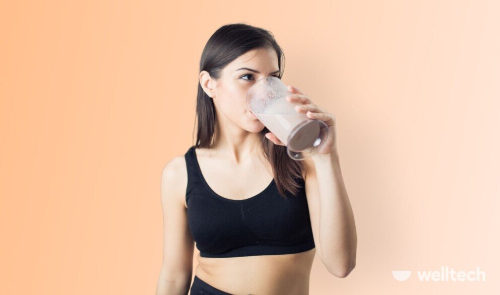 a woman is drinking protein shake, fasting protein shake