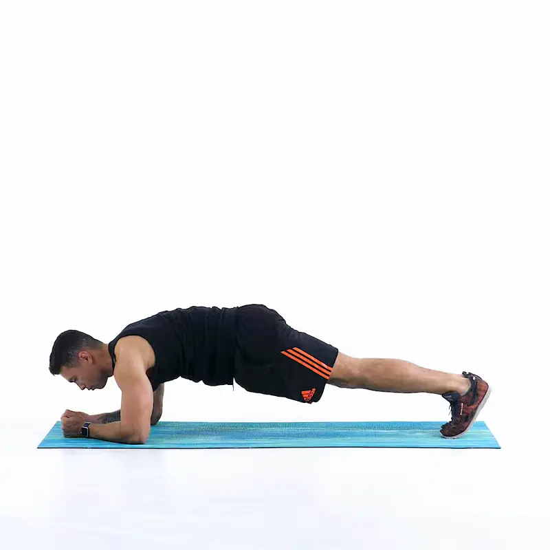 a man is performing knee to elbow plank_ab exercises that don’t hurt lower back