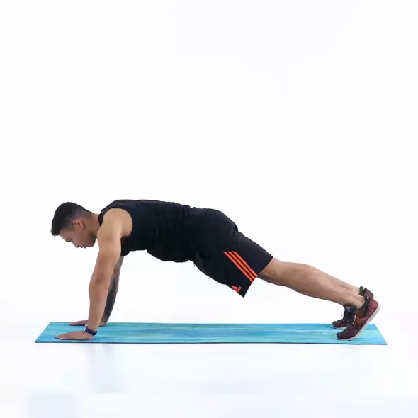a man is performing Push-up Plank, ab exercises that don't hurt lower back