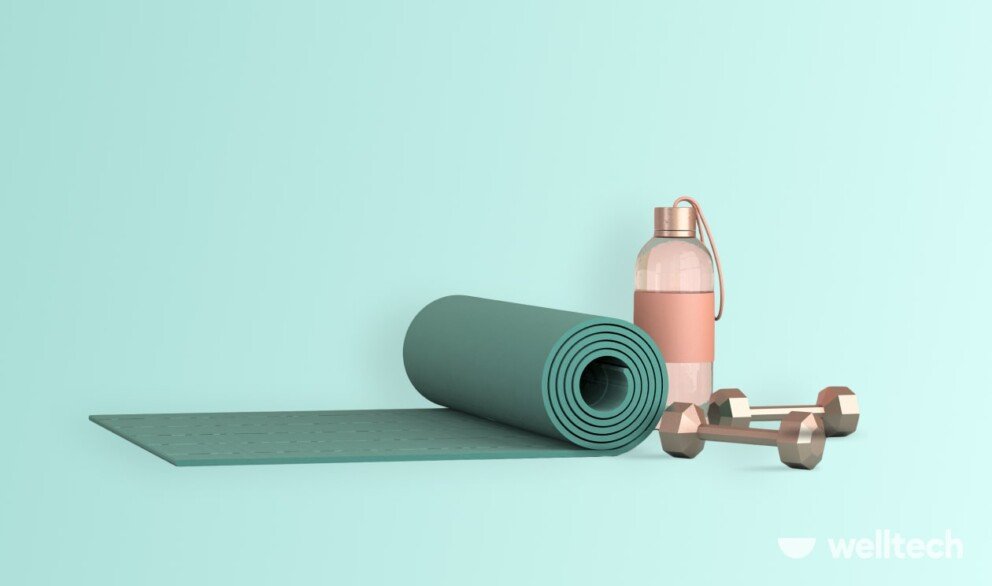 yoga mat with a pair of small dumbbells and water bottle, yoga before or after workout