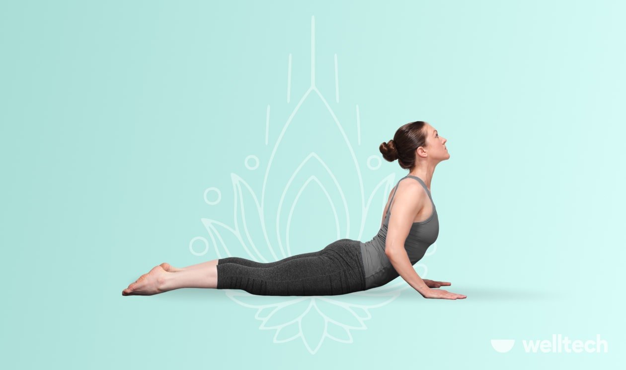 a woman is doing cobra pose, yoga for belly fat