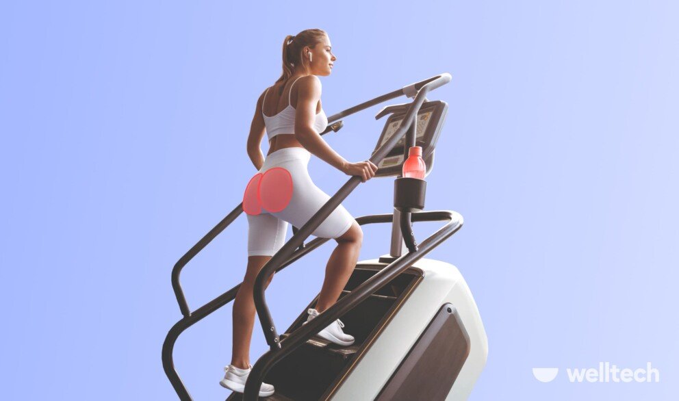 a woman is climbing a stairmaster machine, her glutes highlighted, stair stepper muscles worked