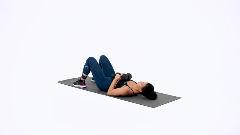 a woman is performing Supine Dumbbell Close Grip Press_breast-firming exercises
