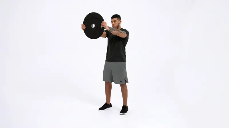 a man is performing Bus Drivers (aka Weighted Steering Wheel)_side delt exercises