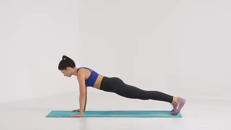 a woman is performing dead stop push-up_breast-firming exercises