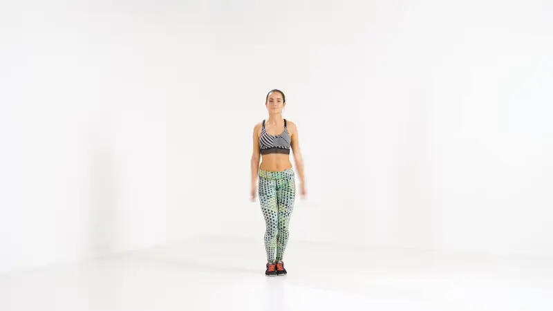 a woman is performing jumping jacks_burpee alternatives