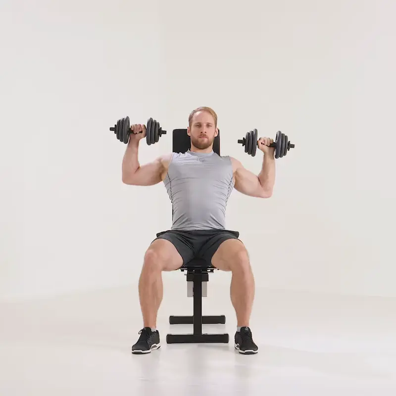 a man is performing Shoulder Presses (Seated Military Press)_side delt exercises