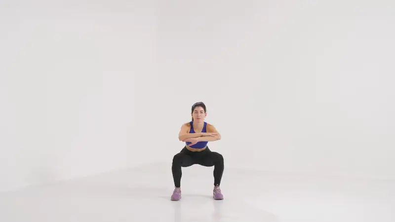 a woman is performing squat jumps_burpee alternatives