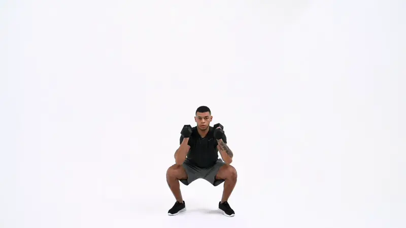 a man is performing thruster exercises with dumbbells_burpee alternatives