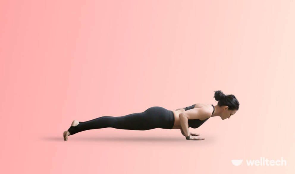 a woman is practicing yoga, doing Four-Limbed Staff Pose (Chaturanga Dandasana)_weight-loss yoga poses