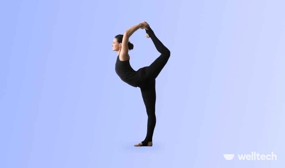 a woman is doing yoga, practicing Dancer Pose (Natarajasana)_standing yoga poses