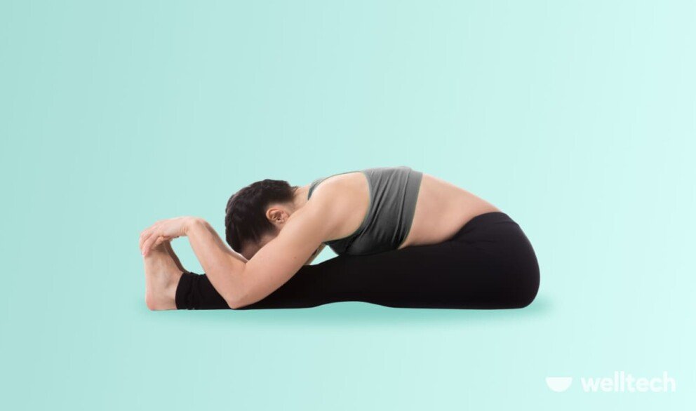 a woman is practicing yoga, doing Seated Forward Bend (Paschimottanasana), splits in yoga