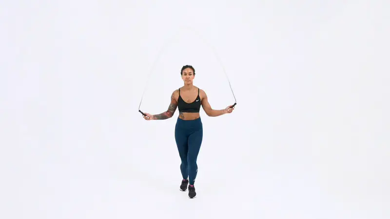a woman is doing Jump Rope Ali Shuffle_knee fat exercises