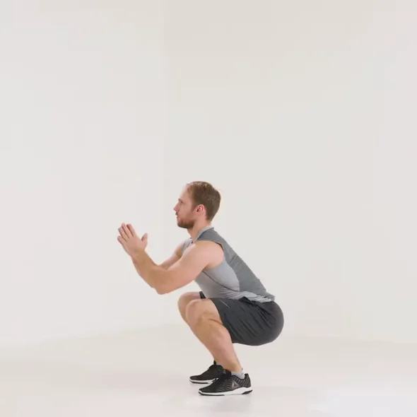 a man is doing squat to calf raise_leg day warm up