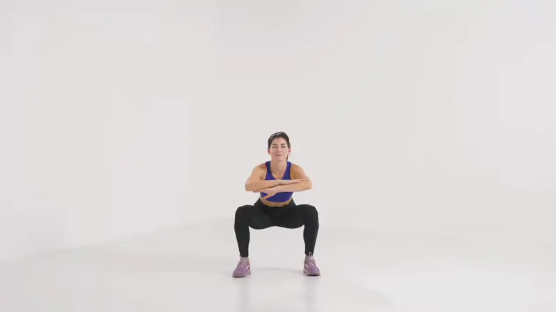 a woman is doing squat to knee up_knee fat exercises