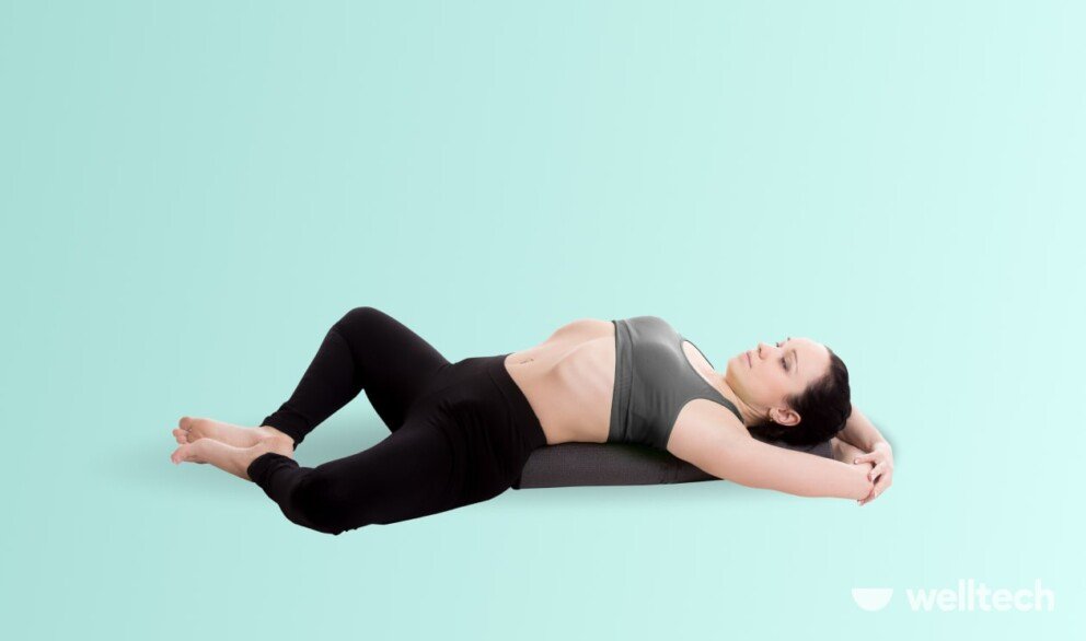 a woman is practicing yoga, doing Reclined Bound Angle Pose (Supta Baddha Konasana)_yoga poses relaxing