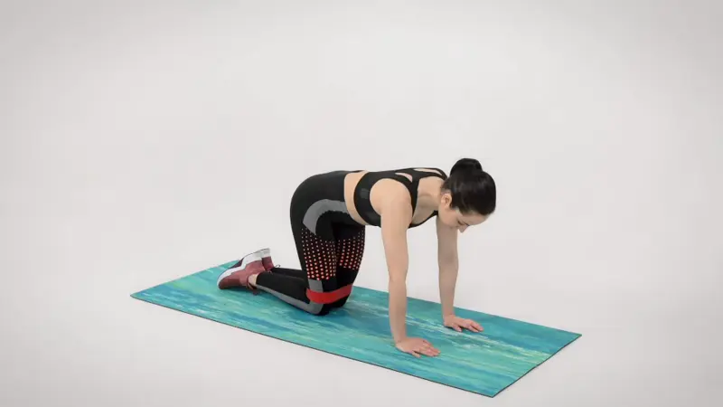 a woman is performing Quadruped Hip Abduction_side glute exercises