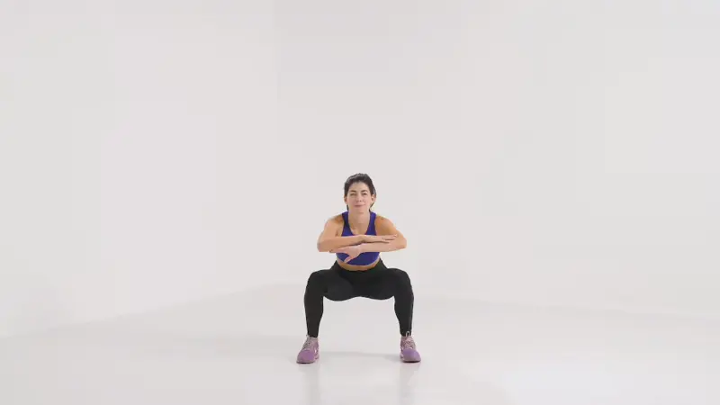 a woman is performing Squat With Side Leg Raise_side glute exercises