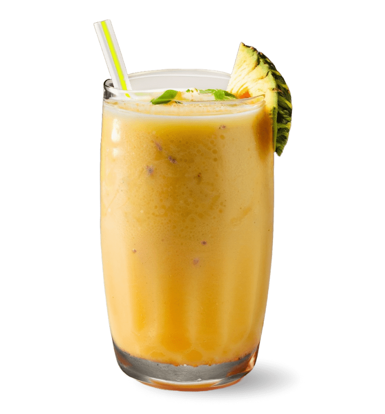 a tall glass of a yellow-orange smoothie, likely made from tropical fruits such as mango or pineapple, as indicated by the pineapple slice garnish on the rim of the glass. The presence of small dark specks throughout the smoothie suggests that it may contain seeds or pieces of fruit. The glass has a straw in it, and there seems to be a layer of a darker colored juice at the bottom, which might be a type of berry or cherry juice. A few green leaves, possibly mint, are visible on top, adding a fresh accent