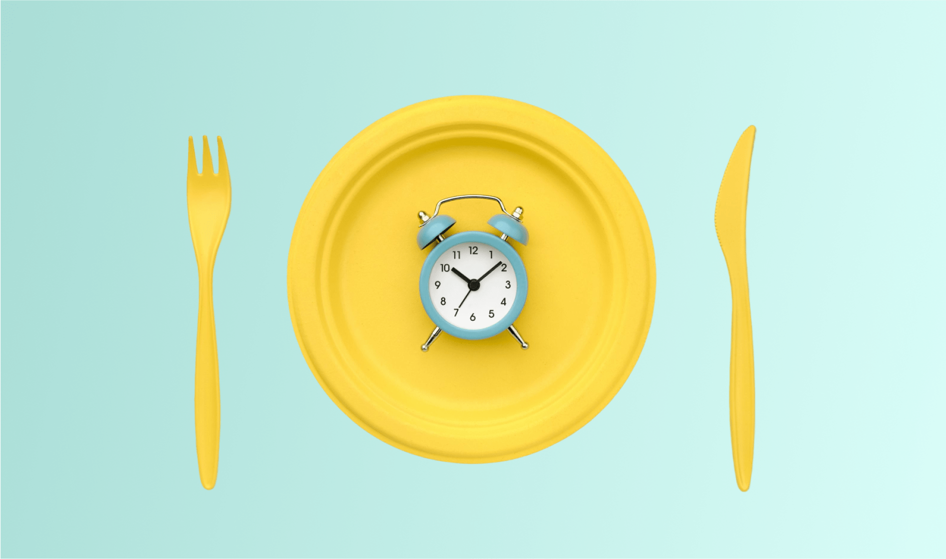 A conceptual representation of intermittent fasting featuring a yellow plate with a blue alarm clock at its center, flanked by a yellow fork on the left and a yellow knife on the right, against a pastel blue background. This imagery prompts the question: Can You Take Medicine While Intermittent Fasting?