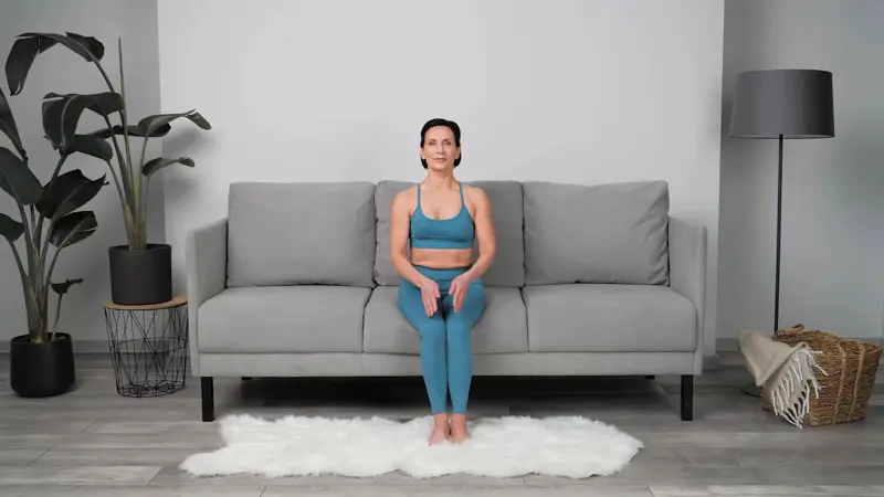 a woman is doing yoga in bed_sofa yoga_practicing Seated Cat and Cow Pose