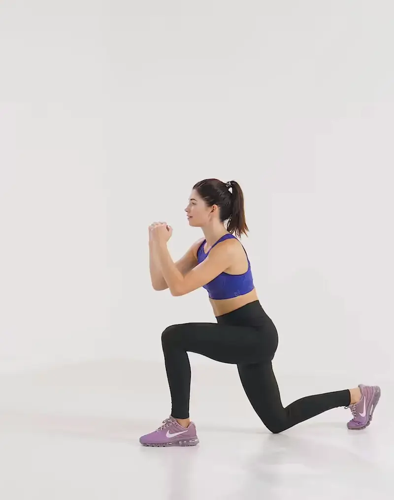 a woman is performing cardio legs workout, doing Lunge With Front Kick