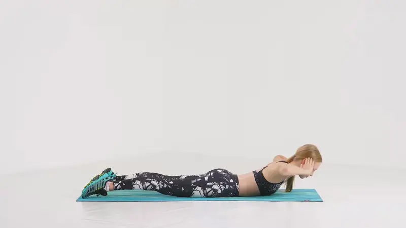 a woman is working out, doing Trunk Half Circles_back exercises without weights