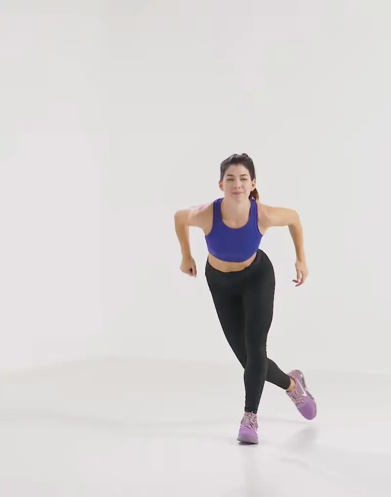 a woman is performing cardio legs workout, doing skater hops