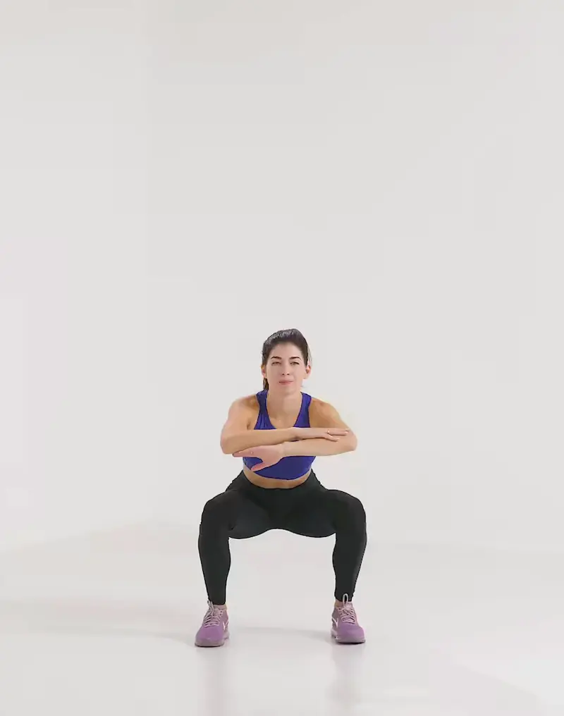 a woman is performing cardio legs workout, doing squat jump