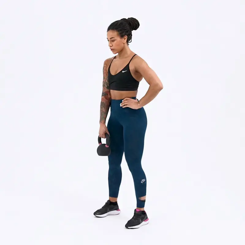 a woman is working out, doing One Arm Kettlebell Deadlift_how to lose upper body fat