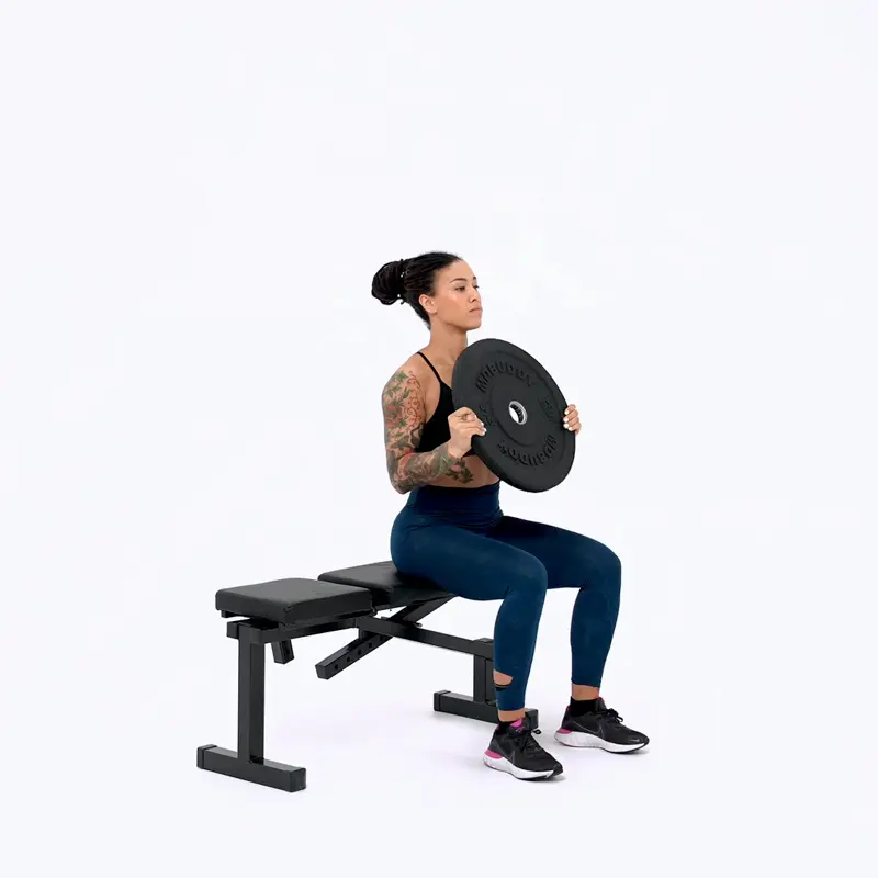 a woman is working out, doing Seated Plate Shoulder Press, how to lose upper body fat