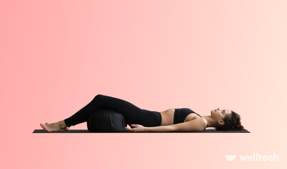a woman is practicing yoga, doing corpse pose_yoga for period cramps