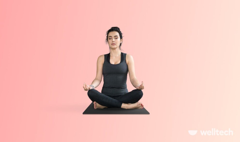 a woman is practicing yoga, doing easy pose_yoga for period cramps